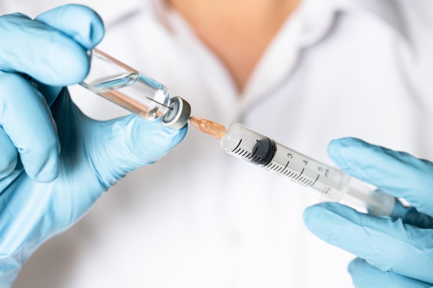 Vaccine vial and syringe